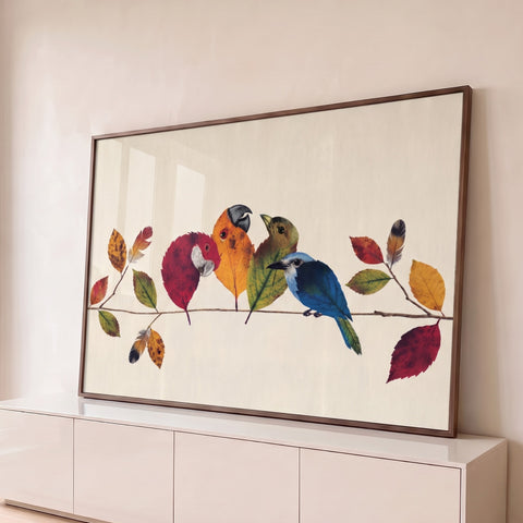Pássaros feitos de folhas de outono vermelhas, laranjas, verdes e azuis num galho, quadro decorativo