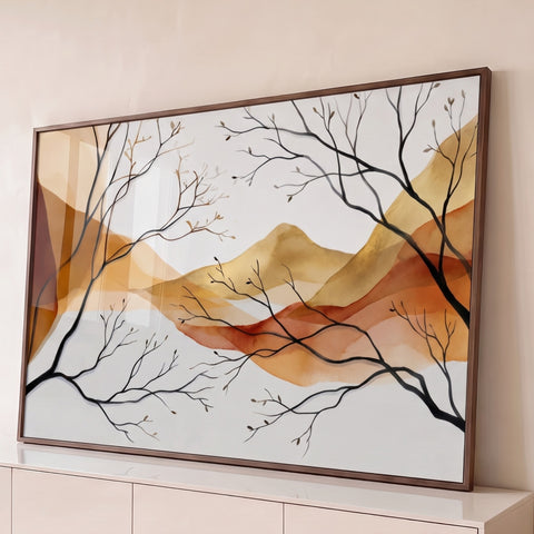 Montanhas em aquarela terracota e dourada com galhos secos pretos sobre fundo claro, quadro decorativo