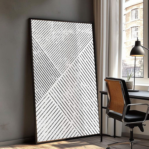 quadro decorativo branco com padrão geométrico preto e linhas abstratas
