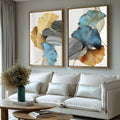 Folhas de ginkgo azuis, douradas e âmbar com traços cinza sobre fundo branco em 2 telas, quadro decorativo
