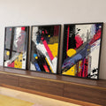 Trio abstrato com respingos pretos, faixas vermelhas, círculos amarelos e linhas azuis, quadro decorativo