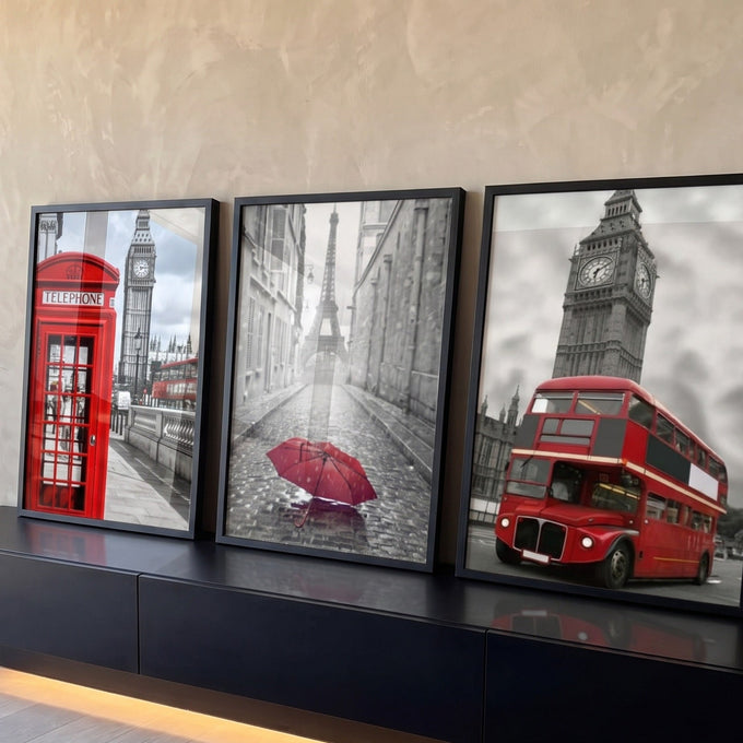 Big Ben com cabine e ônibus vermelhos e Torre Eiffel com guarda-chuva em preto e branco quadro decorativo