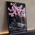 Cerejeira bonsai com flores rosa sobre rochas escuras e fundo preto, quadro decorativo