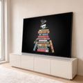 Pilha de livros antigos coloridos com xícara de chá e óculos sobre fundo preto, quadro decorativo