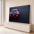 Ferrari F40 vermelha vista de trás com lanternas acesas sobre asfalto escuro ao anoitecer, quadro decorativo