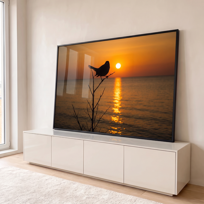 Quadro Decorativo Grande Pássaro em Silhueta para Sala | quadros decorativos para sala | pássaro em silhueta sobre galho seco com pôr do sol refletido no mar | em Quadros para Sala | Porao dos Quadros