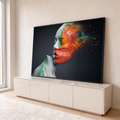 Quadro Decorativo Grande Rosto Feminino para Sala Branco | quadros decorativos para sala | perfil feminino pintado em branco, verde, laranja e vermelho se desintegrando em pó colorido | em Quadros para Sala | Porao dos Quadros