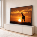 Silhueta de girafa diante do sol se pondo na savana africana sob céu laranja, quadro decorativo