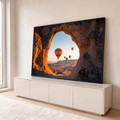 Quadro Decorativo Grande Balões de Ar Laranja para Sala | quadros decorativos para sala | balões de ar quente coloridos vistos por abertura de pedra na Capadócia ao amanhecer | em Quadros para Sala | Porao dos Quadros
