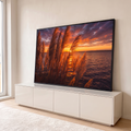 Quadro Decorativo Grande Capim dos Pampas Laranja para Sala | quadros decorativos para sala | capim dos pampas dourado silhuetado contra pôr do sol laranja sobre a água | em Quadros para Sala | Porao dos Quadros
