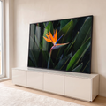 Quadro Decorativo Grande Flor Ave do Paraíso para Sala | quadros decorativos para sala | flor ave do paraíso laranja e azul entre folhas verdes tropicais em close-up | em Quadros para Sala | Porao dos Quadros