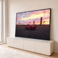 Ferrari F40 vermelha no asfalto com marcas de pneu sob céu rosa de pôr do sol e palmeiras, quadro decorativo