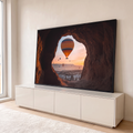Quadro Decorativo Grande Balão de Ar para Sala Laranja | quadros decorativos para sala | balão de ar quente visto por abertura de rocha sobre vale ao nascer do sol | em Quadros para Sala | Porao dos Quadros
