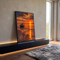 Quadro Decorativo Grande Veleiro na Maré para Sala Laranja | quadros decorativos para sala | veleiro branco ancorado em águas rasas sob céu alaranjado de pôr do sol | em Quadros para Sala | Porao dos Quadros