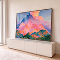 Quadro Decorativo Montanha Rosa e Azul ao Amanhecer | quadros decorativos para sala | pico montanhoso rosa e azul sob nuvens douradas em pintura colorida | em Quadros para Sala | Porao dos Quadros
