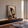 Quadro Decorativo Grande Mulher Lendo Livro para Sala Bege | quadros decorativos para sala | mulher de cabelo preso lendo livro cercada de livros e flores em estilo impressionista | em Quadros para Sala | Porao dos Quadros