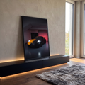 Quadro Decorativo Grande Carro e Amarelo para Sala Preto | quadros decorativos para sala | carro esportivo preto fosco com faixa laranja e faróis acesos em garagem escura | em Quadros para Sala | Porao dos Quadros