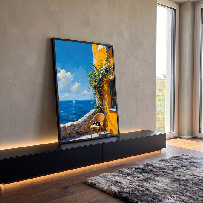 Quadro Decorativo Gato Dormindo em Terraço à Beira Mar | quadros decorativos para sala | gato preto e branco dormindo em cadeira de vime junto a parede amarela florida com mar ao fundo | em Quadros para Sala | Porao dos Quadros