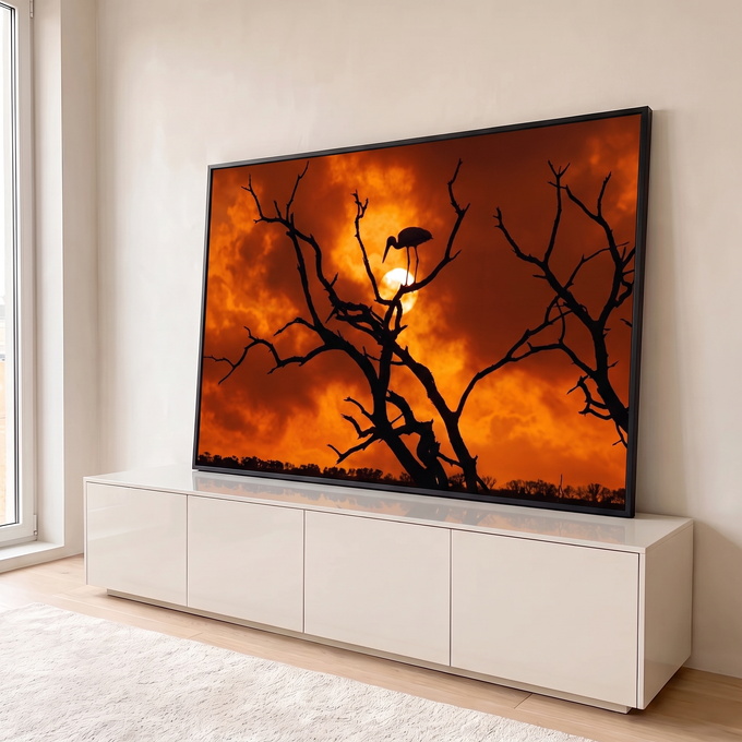 Quadro Decorativo Grande Ave em Galho Seco para Sala Laranja | quadros decorativos para sala | silhueta de ave em galho seco contra céu laranja intenso ao pôr do sol | em Quadros para Sala | Porao dos Quadros