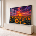Campo de girassóis amarelos ao pôr do sol sob nuvens roxas e laranja, quadro decorativo