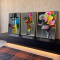 Quadro Decorativo Kit 3 Telas Rostos Dente-de-leão para Sala | quadros decorativos para sala | tríptico surreal com rosto de um olho, escultura colorida e dente-de-leão florido | em Quadros para Sala | Porao dos Quadros