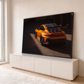 Quadro Decorativo Grande Carro Automotivo para Sala | quadros decorativos para sala | carro esportivo laranja metálico visto de trás com aerofólio e luz lateral forte | em Quadros para Sala | Porao dos Quadros