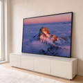 Quadro Decorativo Grande Pico Nevado para Sala Rosa | quadros decorativos para sala | pico de montanha nevado emergindo de mar de nuvens sob céu rosa ao pôr do sol | em Quadros para Sala | Porao dos Quadros