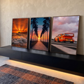 Quadro Decorativo Kit 3 Telas Pôr do Sol Carro para Sala | quadros decorativos para sala | tríptico com pôr do sol na praia, palmeiras e carro esportivo laranja ao entardecer | em Quadros para Sala | Porao dos Quadros