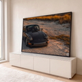 Quadro Decorativo Grande Carro Esportivo Praia para Sala | quadros decorativos para sala | carro esportivo cinza-escuro em dunas de areia sob luz dourada de pôr do sol | em Quadros para Sala | Porao dos Quadros