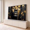 Quadro Decorativo Grande Rosto com Tinta para Sala Preto | quadros decorativos para sala | rosto com olhos fechados coberto de tinta dourada escorrendo sobre fundo preto | em Quadros para Sala | Porao dos Quadros