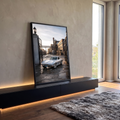 Quadro Decorativo Grande Carro Clássico Prata para Sala | quadros decorativos para sala | carro esportivo clássico prata visto de trás em pátio industrial ao entardecer | em Quadros para Sala | Porao dos Quadros