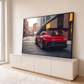 Quadro Decorativo Grande Carro Aerofólio para Sala Vermelho | quadros decorativos para sala | carro esportivo vermelho com aerofólio preto em rua de tijolos | em Quadros para Sala | Porao dos Quadros