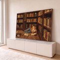 Quadro Decorativo Grande Mulher Lendo Marrom para Escritório | quadros decorativos para sala | mulher deitada lendo livro no chão entre estantes repletas de livros coloridos | em Quadros para Escritório | Porao dos Quadros