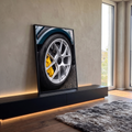 Quadro Decorativo Grande Roda Esportiva para Escritório Azul | quadros decorativos para sala | close de roda esportiva prateada com pinça de freio amarela e pneu preto | em Quadros para Escritório | Porao dos Quadros