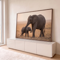 Quadro Decorativo Grande Elefanta e Filhote para Sala Bege | quadros decorativos para sala | elefanta envolve filhote com a tromba em savana ao entardecer | em Quadros para Sala | Porao dos Quadros