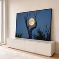 Quadro Decorativo Grande Lua Árvore Seca para Sala | quadros decorativos para sala | lua cheia dourada entre galhos de árvore seca contra céu azul escuro | em Quadros para Sala | Porao dos Quadros