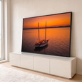 Quadro Decorativo Grande Veleiro Iluminado para Sala Laranja | quadros decorativos para sala | veleiro de dois mastros iluminado com luzes, ancorado em mar calmo ao pôr do sol laranja | em Quadros para Sala | Porao dos Quadros