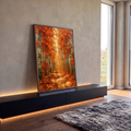 Quadro Decorativo Caminho na Floresta de Outono com Luz | quadros decorativos para sala | floresta de outono com caminho de folhas e luz dourada ao fundo entre árvores | em Quadros para Sala | Porao dos Quadros