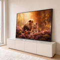Quadro Decorativo Grande Casal de Leões para Sala Laranja | quadros decorativos para sala | leão e leoa se encarando entre flores rosa e luzes douradas flutuantes | em Quadros para Sala | Porao dos Quadros