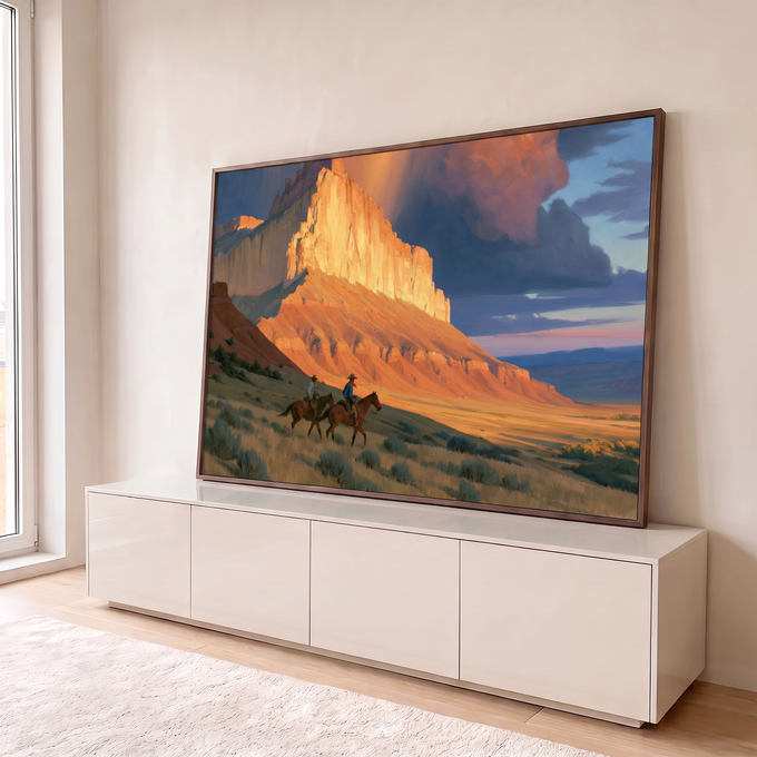 Quadro Decorativo Cavaleiros ao Pôr do Sol no Deserto | quadros decorativos para sala | dois cavaleiros cruzando vale árido com montanha dourada e tempestade ao fundo | em Quadros para Sala | Porao dos Quadros