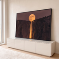 Quadro Decorativo Grande Lua Cheia para Sala Dourado | quadros decorativos para sala | lua cheia dourada sobre penhasco com cachoeira iluminada e silhueta humana ajoelhada | em Quadros para Sala | Porao dos Quadros