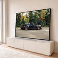 Porsche 911 Targa preto com rodas bronze em velocidade na estrada com floresta ao fundo, quadro decorativo
