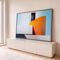 Quadro Decorativo Grande Formas Geometrico para Sala Laranja | quadros decorativos para sala | blocos geométricos laranja, branco e preto formando estrutura abstrata sobre céu azul | em Quadros para Sala | Porao dos Quadros