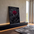 Rosa vermelha solitária entre rochas vulcânicas escuras em fundo preto e cinza, quadro decorativo