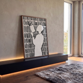 Quadro Decorativo Grande Silhueta Lendo para Sala Preto | quadros decorativos para sala | silhueta bege lendo livro cercada por linhas verticais pretas em estilo gráfico | em Quadros para Sala | Porao dos Quadros