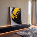 Quadro Decorativo Grande Capô Esportivo para Sala Preto | quadros decorativos para sala | close de capô de carro esportivo preto e amarelo com farol e entradas de ar | em Quadros para Sala | Porao dos Quadros
