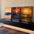 Quadro Decorativo Kit 3 Telas Surfistas e Ondas para Sala | quadros decorativos para sala | surfistas e ondas ao pôr do sol em tríptico com tons laranja e silhuetas | em Quadros para Sala | Porao dos Quadros