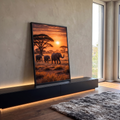 Quadro Decorativo Grande Elefantes na Savana para Sala | quadros decorativos para sala | três elefantes caminhando na savana africana ao pôr do sol laranja | em Quadros para Sala | Porao dos Quadros