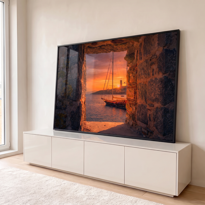 Quadro Decorativo Grande Veleiro e Farol para Sala Laranja | quadros decorativos para sala | veleiro e farol ao pôr do sol vistos através de janela de pedra em ruínas | em Quadros para Sala | Porao dos Quadros