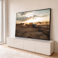 Caminhonete clássica preta levantando poeira em campo de terra ao pôr do sol, quadro decorativo